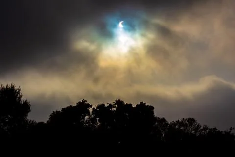 No filter Solar Eclipse and God Rays through Cloudy Fog Stock Photos