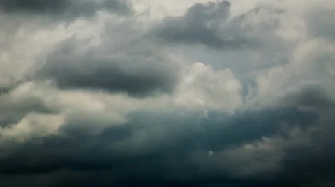 No flicker Time lapse 4k or HD - dark heavy clouds cover all sky, some sun rays Stock Footage 38019846