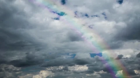 No flicker, Time lapse 4k or HD - dark heavy clouds and rainbow Stock Footage 38599247