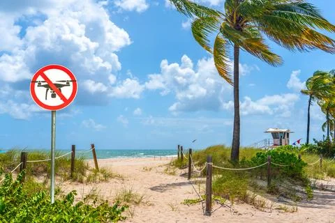 No fly zone sign for drones on a beautiful tropical sunny beach Stock Photos