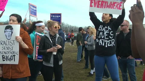 "No hate" chanting protestors at a Donald Trump rally Stock Footage 61203751