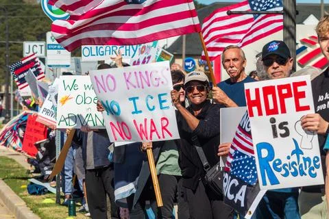 No Kings 3 protesters wave signs at passing cars Stock Photos