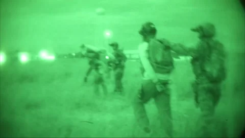 No light imagery of Special Forces soldiers guiding restrained prisoners Video stock 209492472