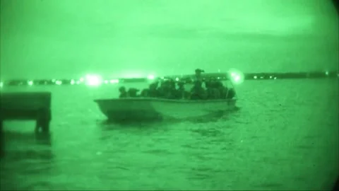No light imagery of U.S. Special Forces soldiers departing in boat Stock Footage 209492473