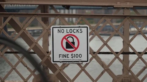 No Locks Warning Sign on Brooklyn Bridge Walkway  	 Stock Footage