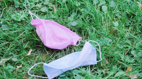 No Longer Needed Protective Masks Fall To The Ground, Recovery From Coronavirus Video stock 138159333