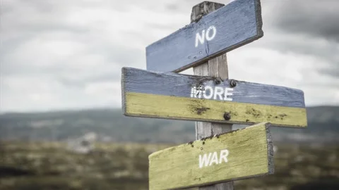 No more war text quote on wooden signpost outdoors, written on the ukranian f Stock Footage 171028422