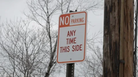 No Parking Any Time This Side sign in front of telephone pole Stock Footage 103966137