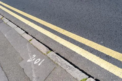 No parking double yellow traffic lines from England. Nobody in the scene with Stock Photos