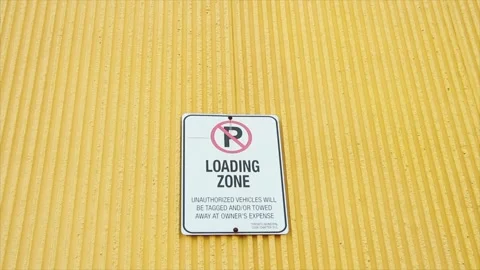 No parking loading zone unauthorized vehicles will be tagged and or towed Stock Footage 252042439
