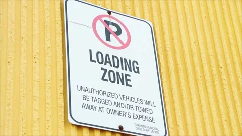 No parking loading zone unauthorized vehicles will be tagged and or towed Video stock 252042462
