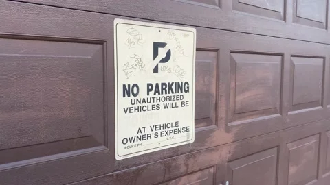 No Parking Unauthorized Vehicles Will Be Towed at Vehicle Owners Expense Si.. Stock Footage 228690158