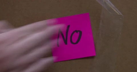 NO - Post it Note - Put On Box - Text of the word "NO" - 4k Stock Footage 66768184
