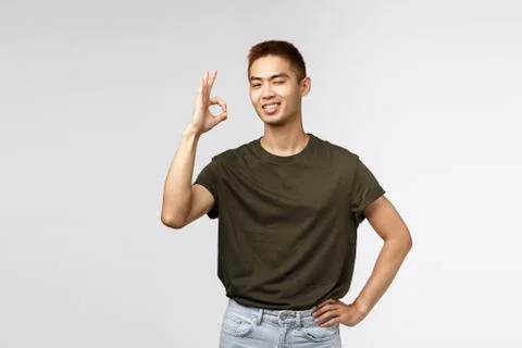 No problem, leave it to me. Satisfied and confident, assertive young asian man Stock Photos