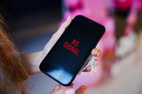 No Signal Error Message on Smartphone Display Screen in Hands Stock Photos