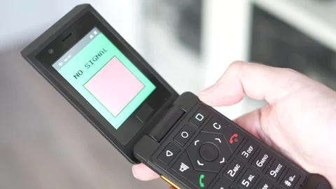No Signal Warning Message on The Screen of a Retro Flip Phone Stock Footage 258515238