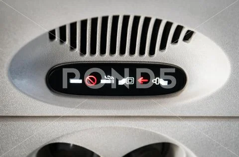 No Smoking and Fasten Seat belt Sign Inside an Airplane. Stock Photos