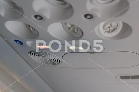 No Smoking and Fasten Seat belt Sign Inside an Airplane. Stock Photos