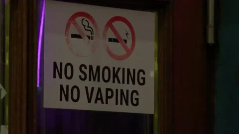 No smoking no vaping decal on glass frame venue restriction Stock Footage 332357480