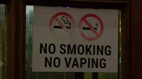 No smoking no vaping sign on wooden door compliance notice Stock Footage 332357451