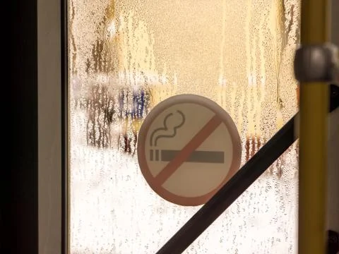 No smoking sign view from inside the bus Stock Photos