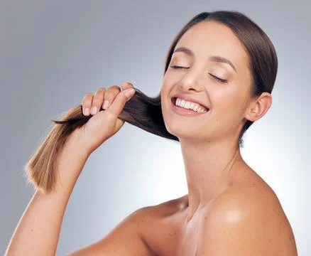 No split ends over here. an attractive young woman standing alone in the studio Stock Photos