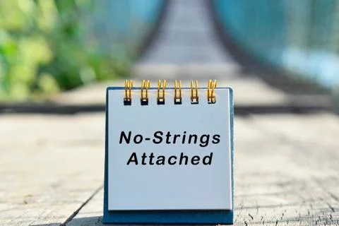 No strings attached text written on white note with blurred background Stock Photos