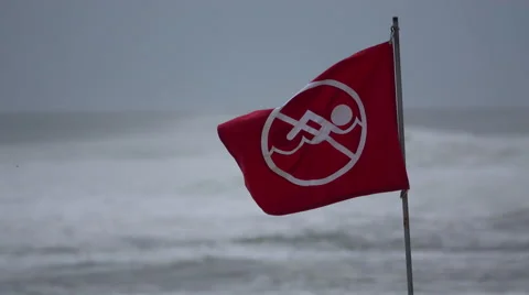 No swimming warning flag blows around Stock Footage 67483592