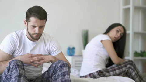 No talking couple sitting on the bed.  Stock Footage 107485262