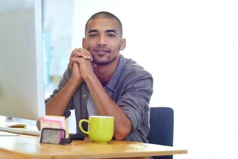 No task too difficult. Portrait of a designer at work on a computer in an office Foto stock