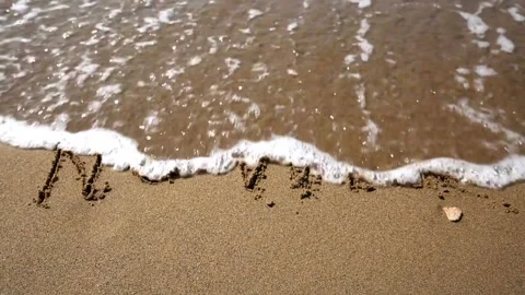 NO WAR Written in Sand Washed Away by Waves Stock Footage 303911954