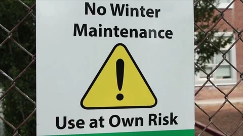 No winter maintenance use at own risk sign with yellow triangle with exclamation Stock Footage 248710954