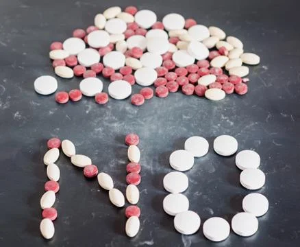NO write of red, white, yellow drugs pills, powder, bunch, no drugs, dark gra Stock Photos