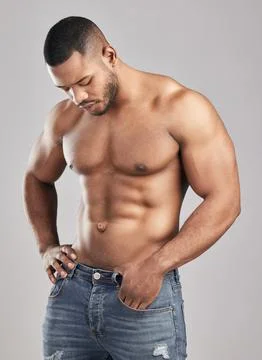 Nobody got in shape by thinking about it. Studio shot of a young muscular man Stock Photos