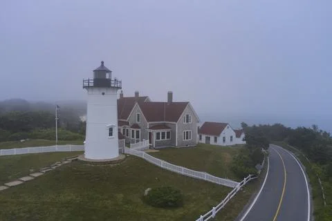 Nobska lighthouse and empty road in fog near Woods Hole, Cape Cod, Stock Photos