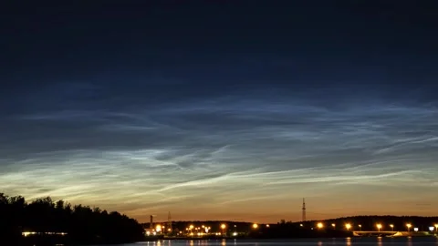 Noctilucent clouds glowing over a river Stock Footage 341287898