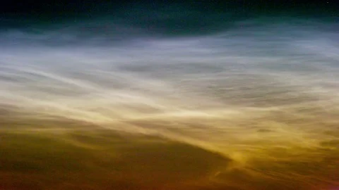 Noctilucent clouds NLC with filament gravity wave structure in midnight sun Stock Footage 77916286
