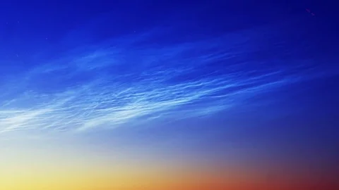 Noctilucent clouds NLC with filament gravity wave structure in summer morning Stock Footage 77916313