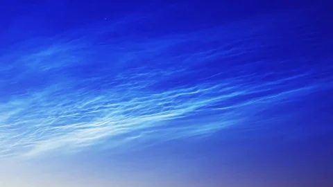 Noctilucent clouds NLC with filament gravity wave structure in summer morning Stock Footage 77916410