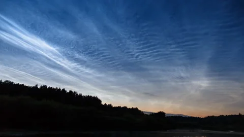 Noctilucent clouds scenic time lapse and fog over a forest. Stock Footage 157706445