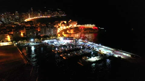 Nocturne aerial view of the Poniente Beach, Marina Benidorm and skyscrapers. Stock Footage 141344598