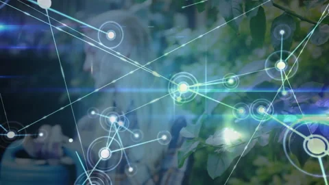 Node appearing over foliage and building network while gardener using watering Stock Footage 314454484