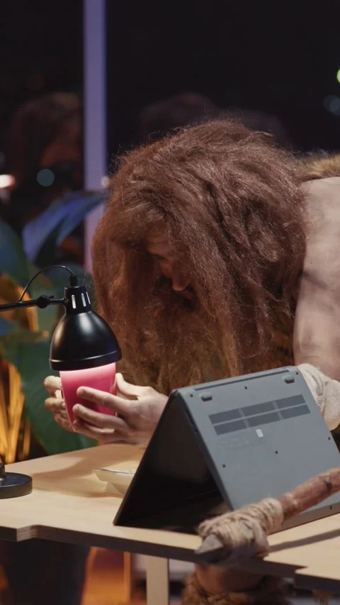 Nomadic couple of two cavemen boss and office assistant using personal computers Stock Footage 313791767