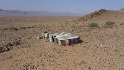 Nomadic Desert Tent in Rocky Moroccan Landscape Aerial Drone View Stock Footage 335636639