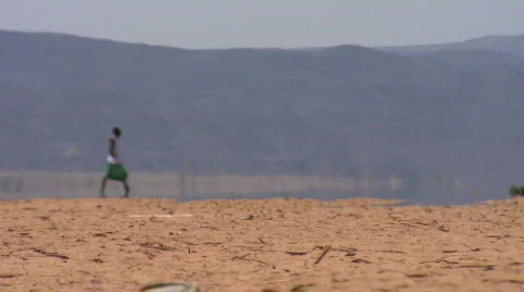 Nomadic man walking through desert  Stock Footage