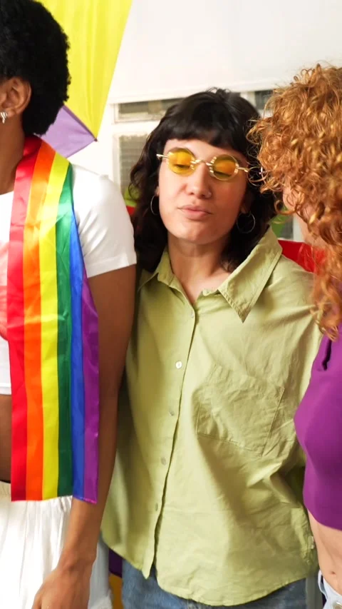 Non binary and transgender people dancing waving rainbow lgbt flag Stock Footage 292223516