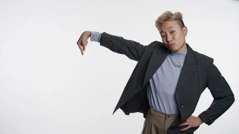 Non-binary Asian professional interacting with white graphic space Stock Footage 153503966
