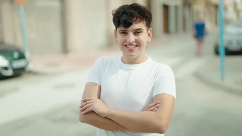Non binary man standing with arms crossed gesture at street Video stock 233417624