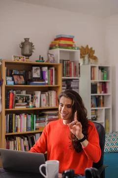 Non-binary person working from home focused on their laptop highlighting wi.. Stock Photos