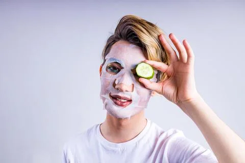 Non binary portrait of asian man with luxurious blonde hair and gorgeous make-up Stock Photos